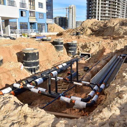 Laying,Heating,Pipes,In,Trench,At,Construction,Site.,Installing,Concrete